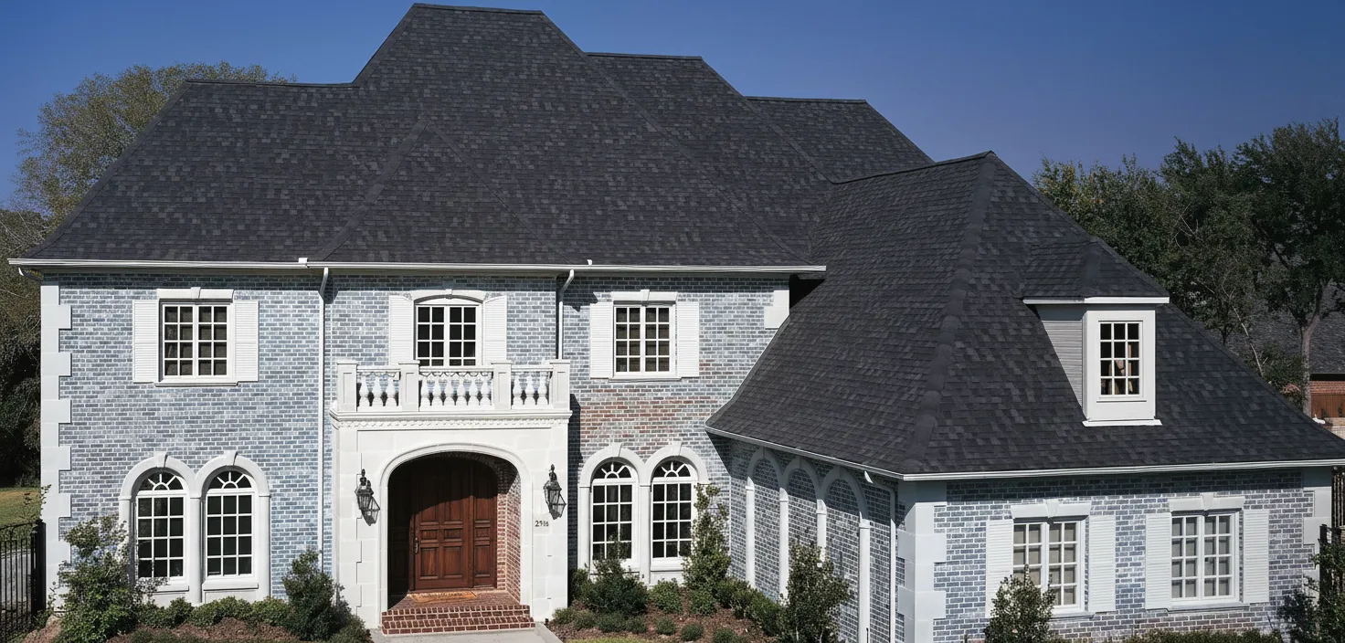Light Blue house with Black roof using Heritage Rustic Black