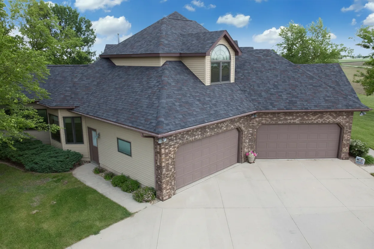 Tan house with Charcoal roof using Vista Black Oak