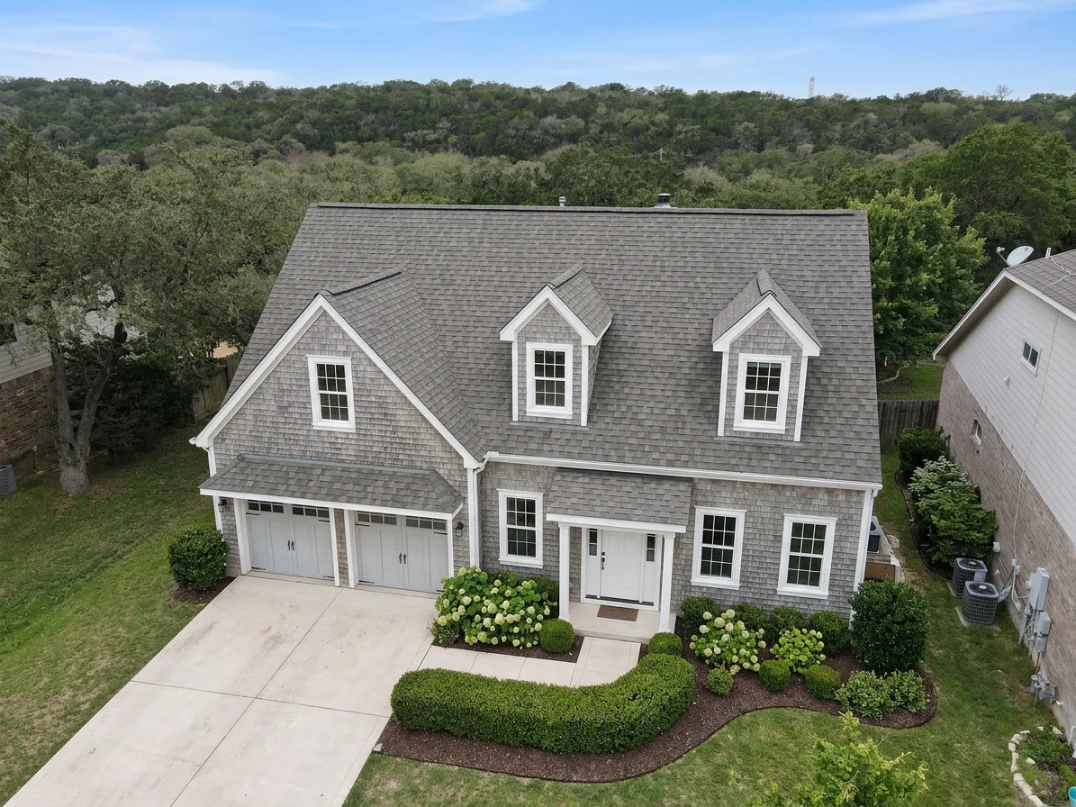 Cape Cod home with Weathered Wood roof -- Owens Corning Oakridge Driftwood (left-34)