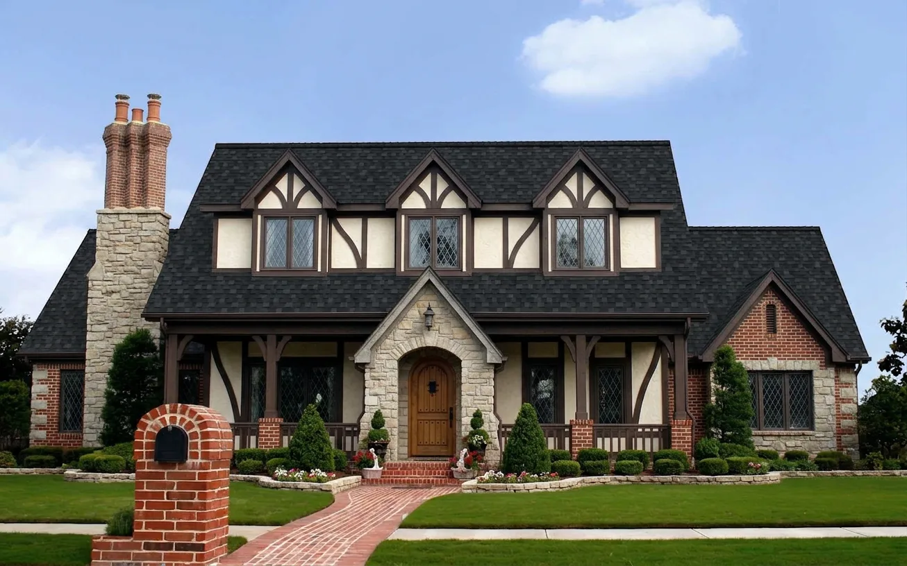Tudor home with Black roof -- Owens Corning Duration Onyx Black (front)